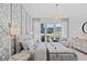 Elegant bedroom featuring a gray upholstered bed and city views at 775 Juniper Ne St # 107, Atlanta, GA 30308