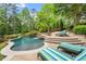 Relaxing pool area with striped lounge chairs at 922 Chattooga Trce, Suwanee, GA 30024