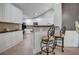 Modern kitchen with white cabinets, dark countertops, and breakfast bar at 223 Fenwick Cir, Mcdonough, GA 30253