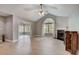 Open living room with fireplace and view of the sunroom at 223 Fenwick Cir, Mcdonough, GA 30253