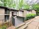 Exterior view of building with walkway and landscaping at 8740 Roswell Rd # 9D, Atlanta, GA 30350