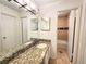Bathroom with granite vanity and updated fixtures at 8740 Roswell Rd # 9D, Atlanta, GA 30350