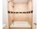 Bathroom with tub/shower combo and tile surround at 8740 Roswell Rd # 9D, Atlanta, GA 30350