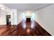 Bright living room with hardwood floors and fireplace at 8740 Roswell Rd # 9D, Atlanta, GA 30350