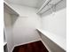 Walk-in closet with wood flooring and shelving at 8740 Roswell Rd # 9D, Atlanta, GA 30350