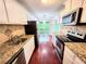 Kitchen with granite counters and stainless steel appliances at 8740 Roswell Rd # 9D, Atlanta, GA 30350