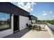 Rooftop deck with table and chairs; modern design at 517 Whitlox Nw Rd, Atlanta, GA 30318