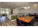 Dining room with a large wood table and modern lighting at 517 Whitlox Nw Rd, Atlanta, GA 30318