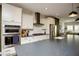 White shaker cabinets, stainless steel appliances, and a large kitchen island at 517 Whitlox Nw Rd, Atlanta, GA 30318