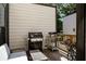 Private deck with grill, small table, and chairs at 517 Whitlox Nw Rd, Atlanta, GA 30318