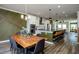 Dining room with a large wood table and modern lighting at 517 Whitlox Nw Rd, Atlanta, GA 30318