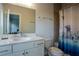 Clean bathroom with white vanity, toilet, and shower/tub combo at 517 Whitlox Nw Rd, Atlanta, GA 30318