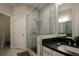 Bathroom with walk-in shower and dark vanity at 517 Whitlox Nw Rd, Atlanta, GA 30318