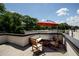 Relaxing rooftop deck with seating and red umbrella at 517 Whitlox Nw Rd, Atlanta, GA 30318