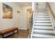 Bright and airy entryway with hardwood floors and modern staircase at 517 Whitlox Nw Rd, Atlanta, GA 30318