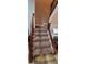 Carpeted staircase with wooden railings at 5970 Wintergreen Rd, Norcross, GA 30093