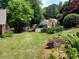 Landscaped backyard with community pool in view at 5970 Wintergreen Rd, Norcross, GA 30093