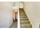 Bright entryway with carpeted stairs and neutral color palette at 3909 Micah Ln, Ellenwood, GA 30294