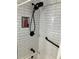 Modern shower with black matte fixtures and white subway tile at 1433 Woodland Sw Ter, Atlanta, GA 30311