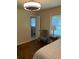 Bright bedroom with hardwood floors and an ensuite bathroom at 1433 Woodland Sw Ter, Atlanta, GA 30311