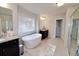 Spa-like bathroom with soaking tub and walk-in shower at 2532 Ozella Sw Pl, Atlanta, GA 30331