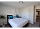 Cozy bedroom with a queen-size bed and ample closet space at 2532 Ozella Sw Pl, Atlanta, GA 30331