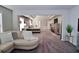 Open concept main bedroom with sitting area and ensuite bath at 2532 Ozella Sw Pl, Atlanta, GA 30331
