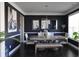 Elegant dining room features dark walls, chandelier, and hardwood floors at 2532 Ozella Sw Pl, Atlanta, GA 30331