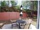 Small patio with table and chairs at 2532 Ozella Sw Pl, Atlanta, GA 30331