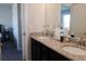 Double vanity bathroom with granite countertop at 2532 Ozella Sw Pl, Atlanta, GA 30331
