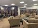 Relaxing community room with ample seating and bookshelves at 3060 Pharr Court North Nw # 609, Atlanta, GA 30305