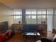 Living room with hardwood floors, comfortable seating, and city views at 3060 Pharr Court North Nw # 609, Atlanta, GA 30305