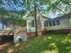 Large white house with wrap around porch and expansive yard at 688 Main St, Whitesburg, GA 30185