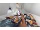 Large attic bedroom with sloped ceilings and window at 688 Main St, Whitesburg, GA 30185