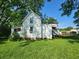 White house with second story deck and large yard at 688 Main St, Whitesburg, GA 30185