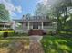 Charming house with wrap-around porch and established landscaping at 688 Main St, Whitesburg, GA 30185