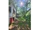 Side view of house exterior showing porch and yard at 688 Main St, Whitesburg, GA 30185