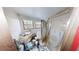 Small bathroom with shower and window at 688 Main St, Whitesburg, GA 30185