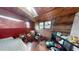 Bedroom with wood walls and skylights at 688 Main St, Whitesburg, GA 30185