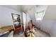 Small bedroom with two windows and access to another room at 688 Main St, Whitesburg, GA 30185