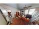 Second bedroom with hardwood floors and a ceiling fan at 688 Main St, Whitesburg, GA 30185