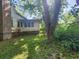 White house exterior with large tree and grassy yard at 688 Main St, Whitesburg, GA 30185