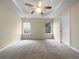 Bright bedroom featuring ceiling fan and ample natural light at 402 Lafayette St, Dallas, GA 30157