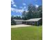 Ranch style home with gray siding, new roof, and a spacious lawn at 3705 Sandhill Se Dr, Conyers, GA 30094