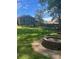 Large backyard with fire pit and patio at 3705 Sandhill Se Dr, Conyers, GA 30094