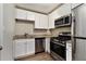 Updated kitchen featuring white cabinets and stainless steel appliances at 2576 Godfrey Nw Dr, Atlanta, GA 30318