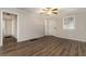 Living room with hardwood floors, neutral walls, and access to hallway at 2576 Godfrey Nw Dr, Atlanta, GA 30318