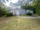 Gray brick ranch house with a grassy front yard at 366 Hamilton E Holmes Nw Dr, Atlanta, GA 30318