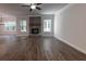 Brick fireplace in a Gathering room with hardwood flooring at 1605 Red Oak Ln, Loganville, GA 30052