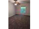 Bedroom with carpet flooring, ceiling fan, and a window at 2936 Parc Lorraine # 2936, Lithonia, GA 30038